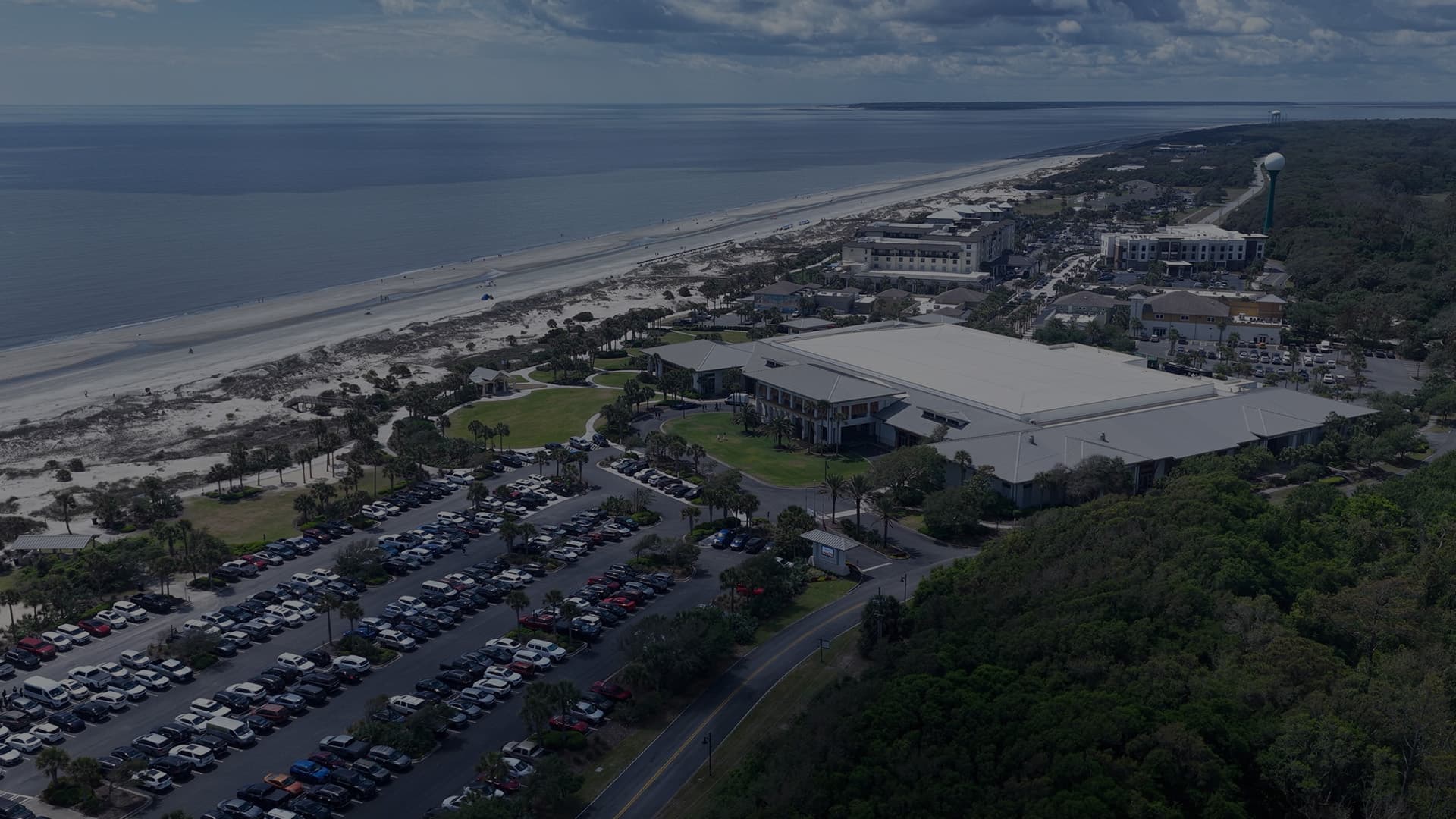 Aerial view of Jekyll Island, Georgia coastline with oceanfront hotels, resorts, and beach.