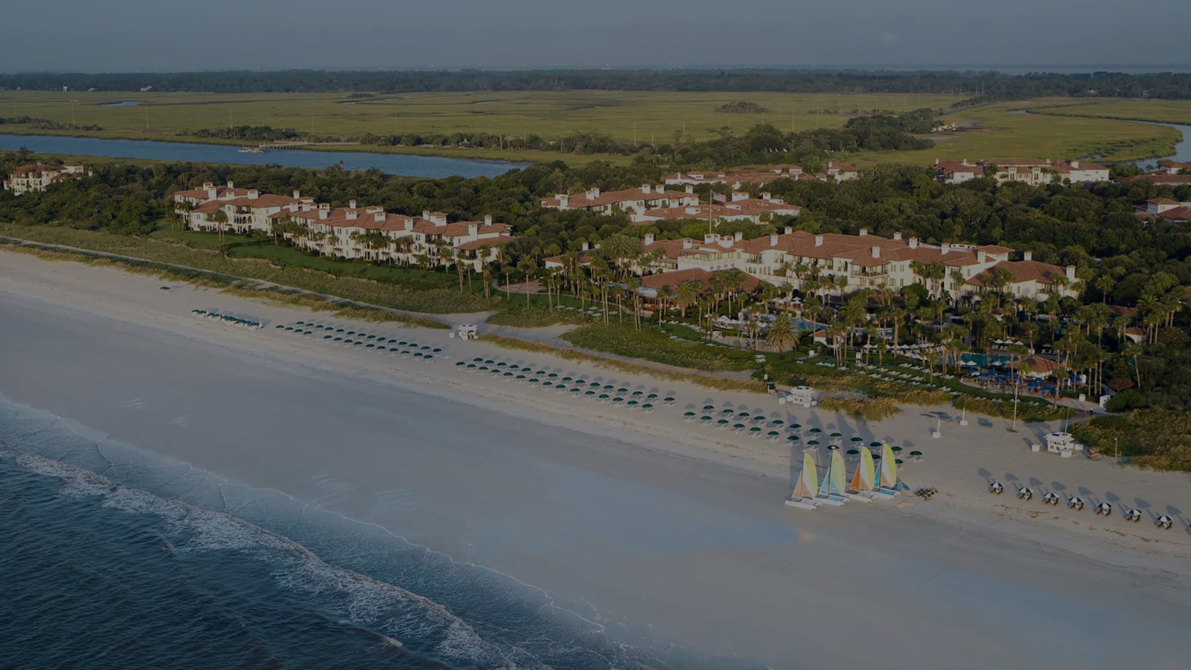 Aerial view of Sea Island, Georgia with pristine Atlantic beaches, luxury resorts, and scenic coastline served by Golden Isles Junk Removal.