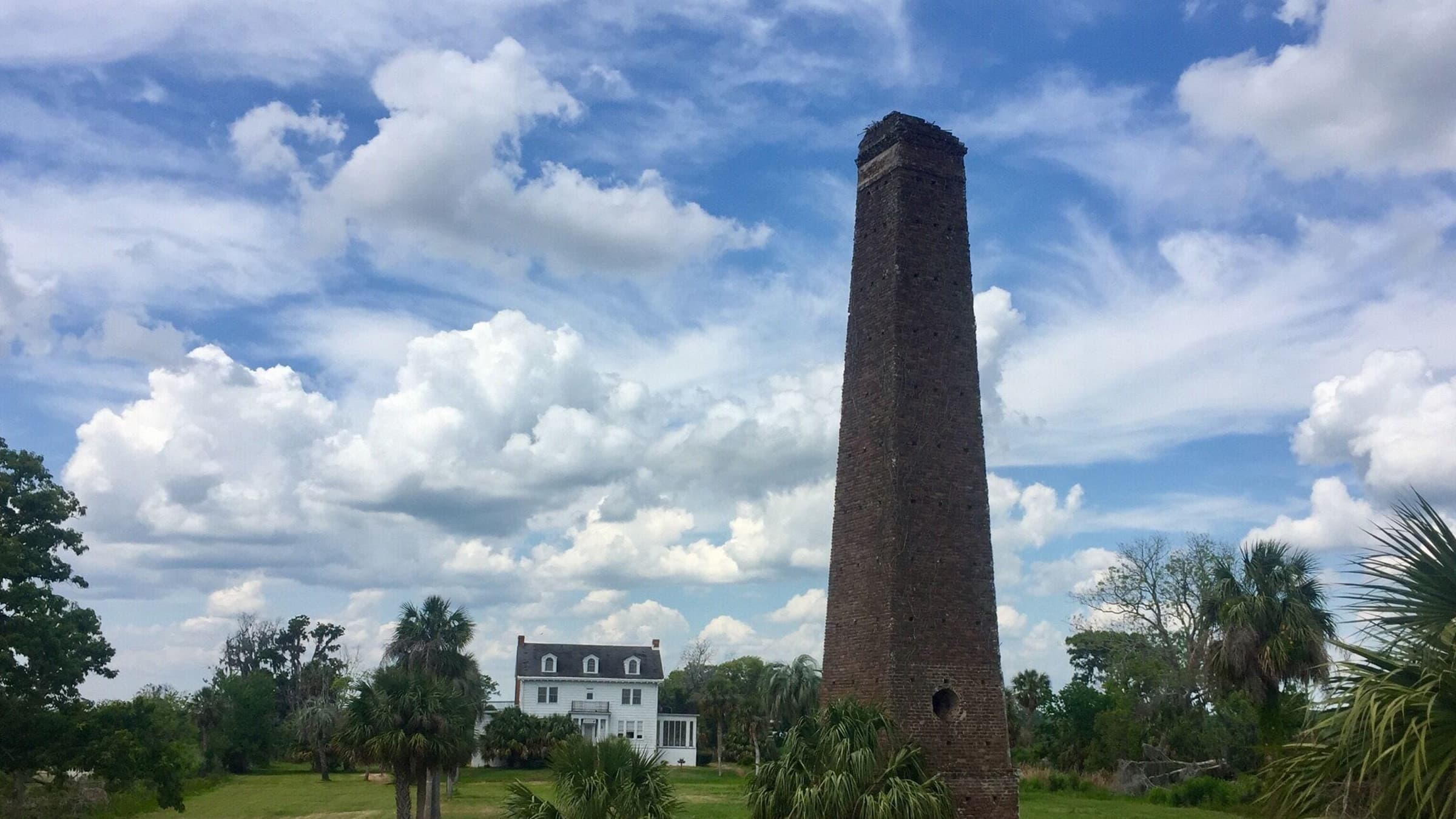 Historic Townsend, Georgia featuring the old sugar mill chimney surrounded by coastal trees and open landscape near Golden Isles Junk Removal service area.
